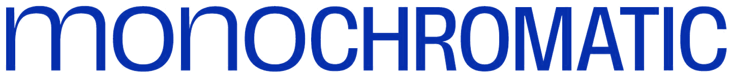 The Monochromatic wordmark: mono set in lowercase light, chromatic in condensed capitals